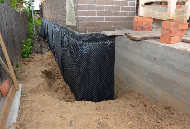 Happy homeowners after waterproofing job in Schwenksville